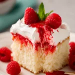 Raspberry Poke Cake With A White Cake Mix First Image